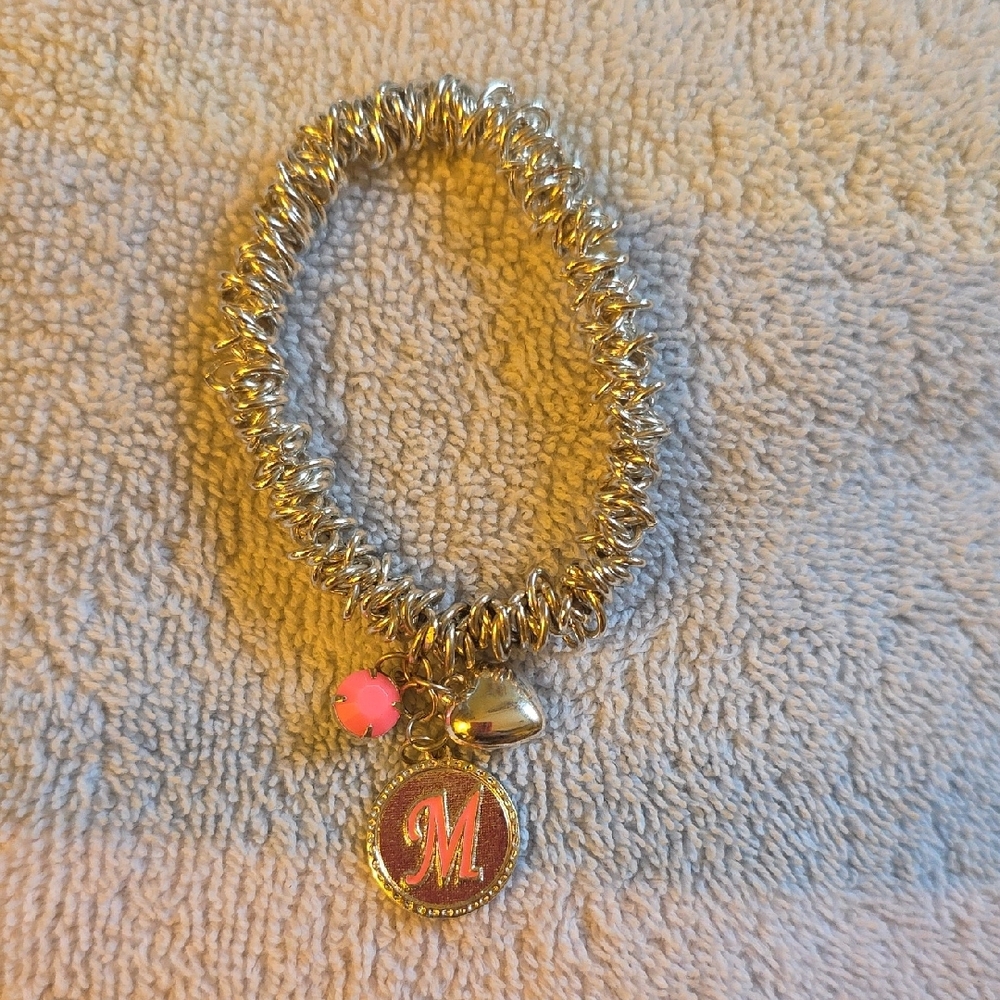 Silver Charm Bracelet with Pink Accent.